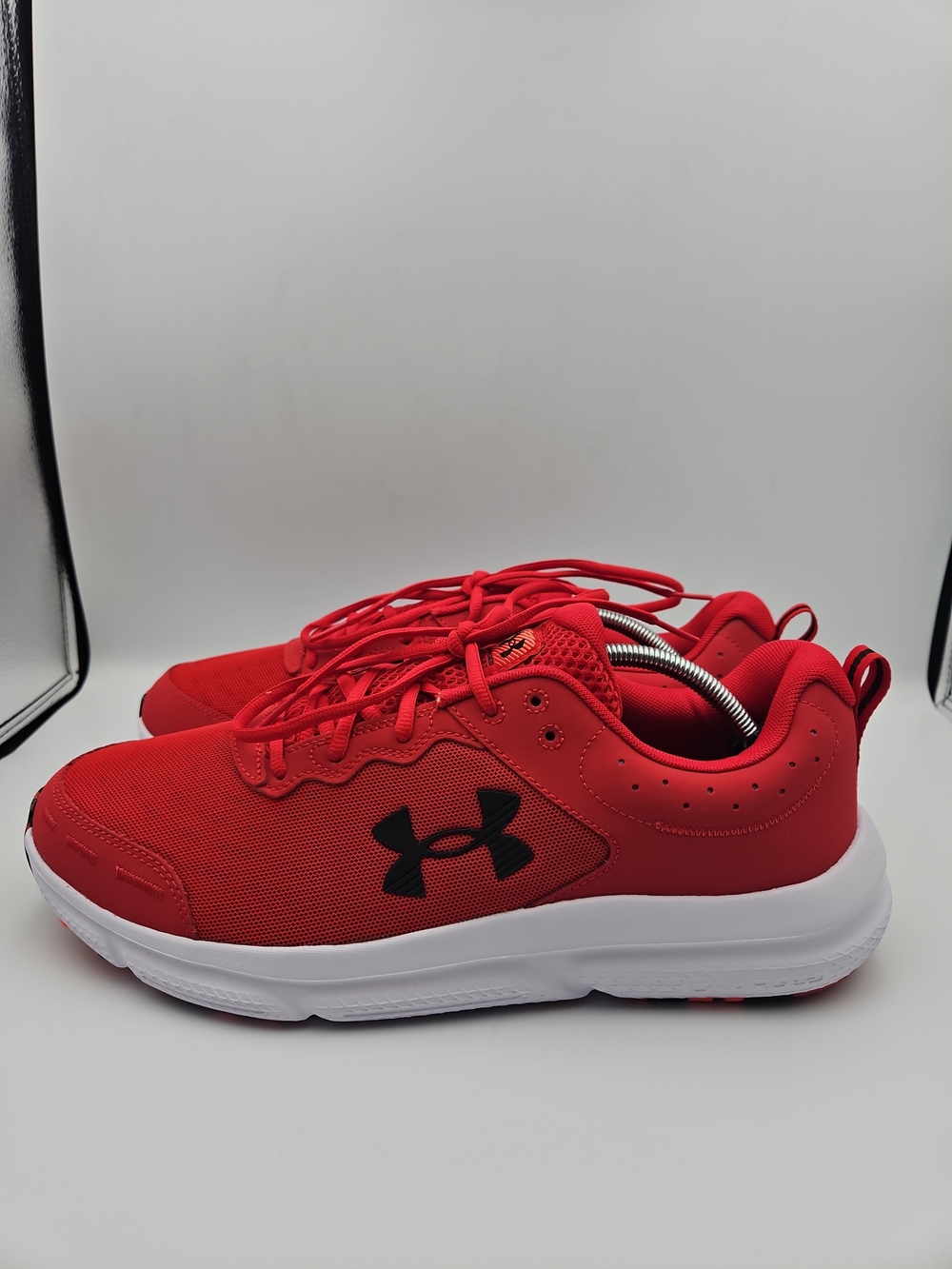Under Armour Red Sneakers with Black Logo and White Sole